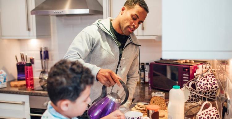 Older man makes tea with child