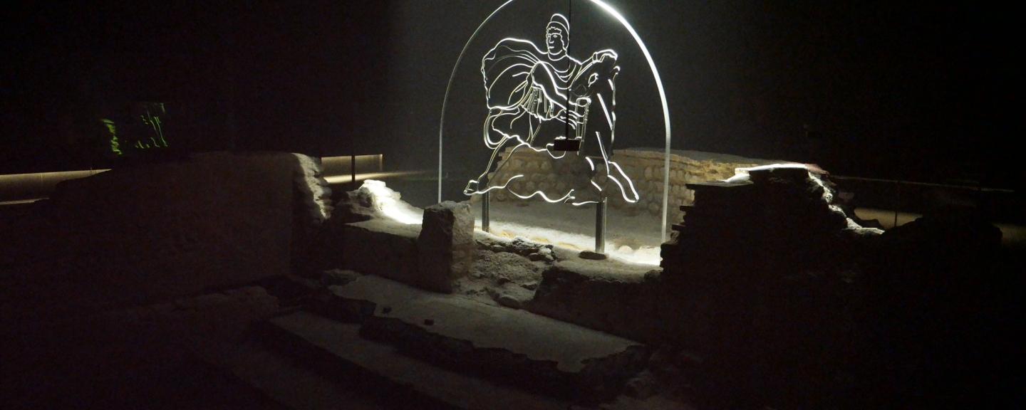 Image of Mithraeum Symbol in glass and illuminated in the dark ruins