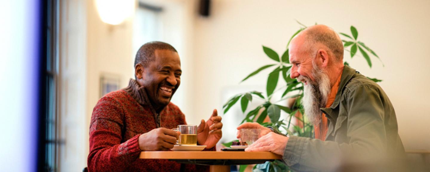 Two men laughing