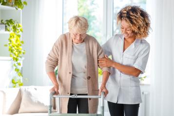 Women assisting women to walk