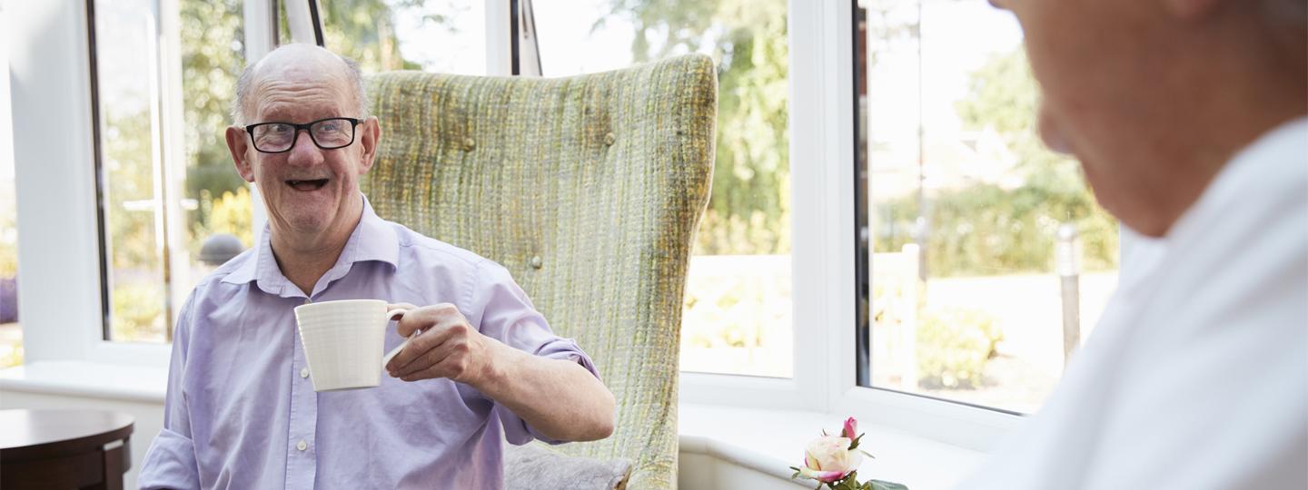 Happy man with tea