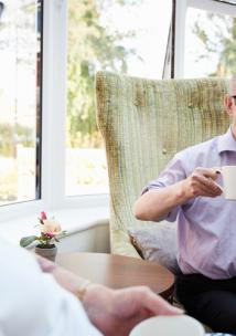 Man Talking to Elderly Man